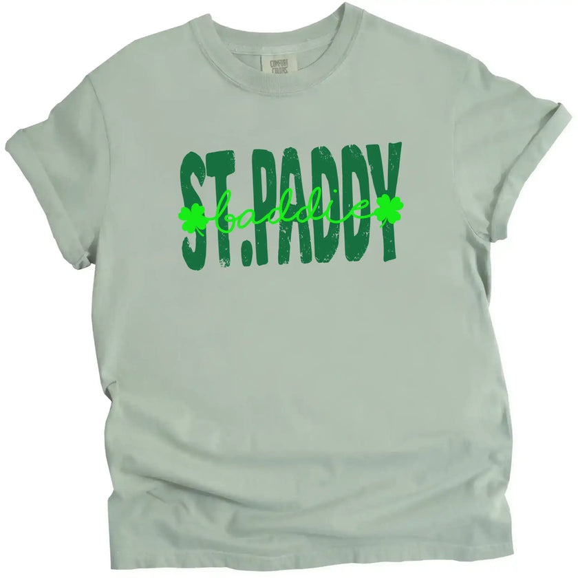 Light green St. Paddy Baddie t-shirt flat lay with playful layered fonts and bright holiday-inspired green shades