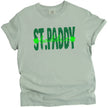 Light green St. Paddy Baddie t-shirt flat lay with playful layered fonts and bright holiday-inspired green shades