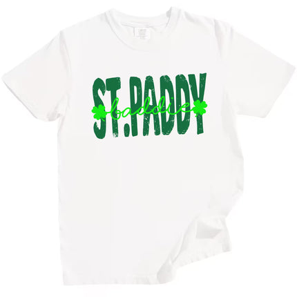 White St. Paddy Baddie t-shirt flat lay highlighting vibrant green lettering and fun mixed-font St. Patrick’s Day design