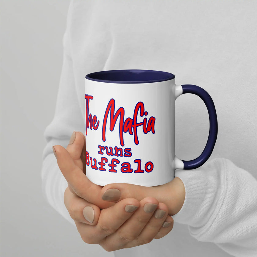 Close-up of white Buffalo football coffee mug with ‘The Mafia Runs Buffalo’ text and red white and blue buffalo silhouette design, game day themed drinkware.