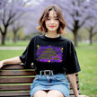 Female model wearing black sarcastic galaxy t-shirt outdoors, ‘The Sarcasm Is Strong With This One’ text with purple blue space design and stars.