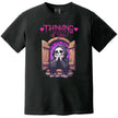 Thinking of You’ t-shirt in black, cute grim reaper leaning from castle window with hearts, dark humor romantic graphic tee.
