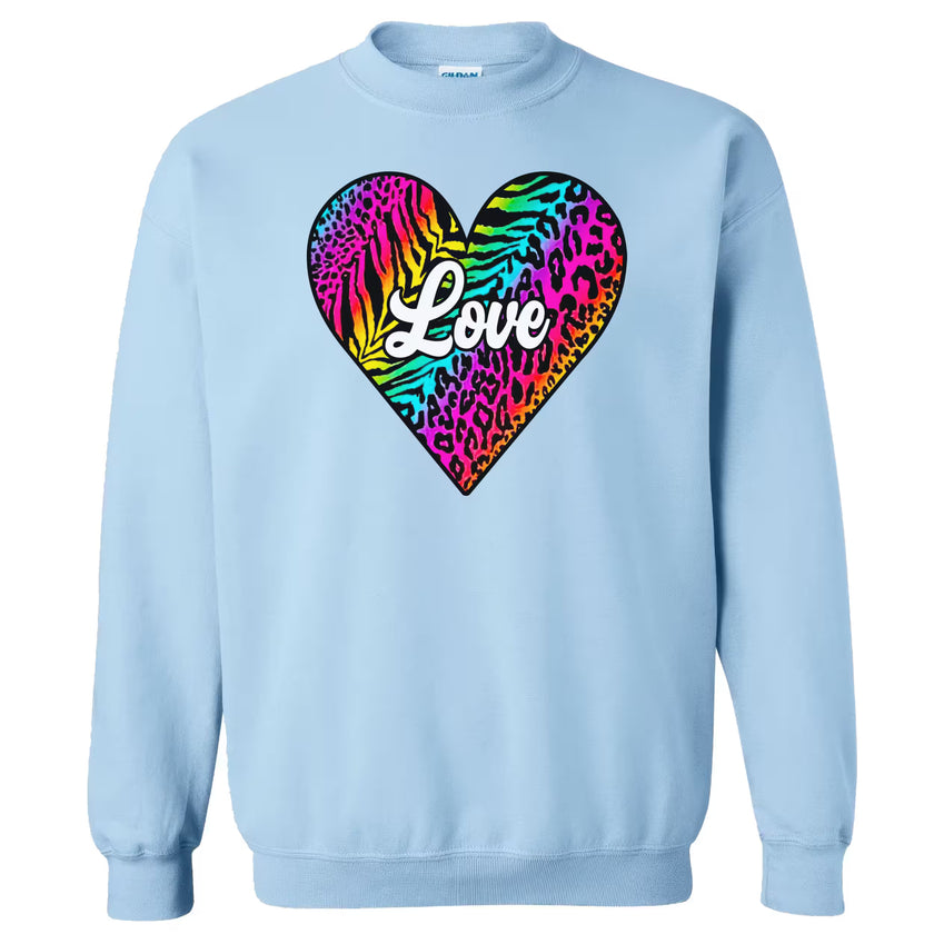 Light blue sweatshirt featuring playful rainbow animal print heart, “Love” in white, flat lay on white