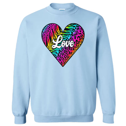 Light blue sweatshirt featuring playful rainbow animal print heart, “Love” in white, flat lay on white