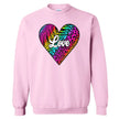 Light pink sweatshirt with vivid rainbow heart and script “Love” graphic, styled flat lay on white