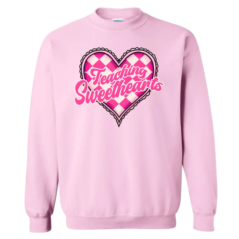 Light pink sweatshirt flat lay with “Teaching Sweethearts” wording and cozy retro heart style for teachers