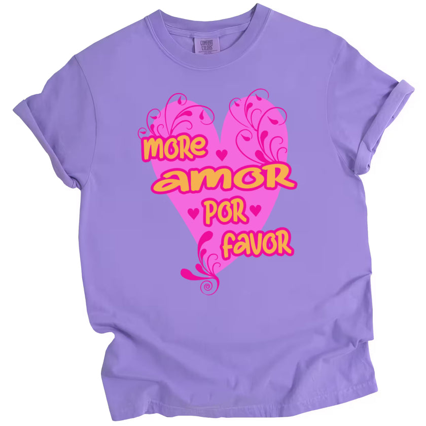 Purple version of the More Amor Por Favor shirt featuring bold orange text over hot pink heart, flat lay on white surface.