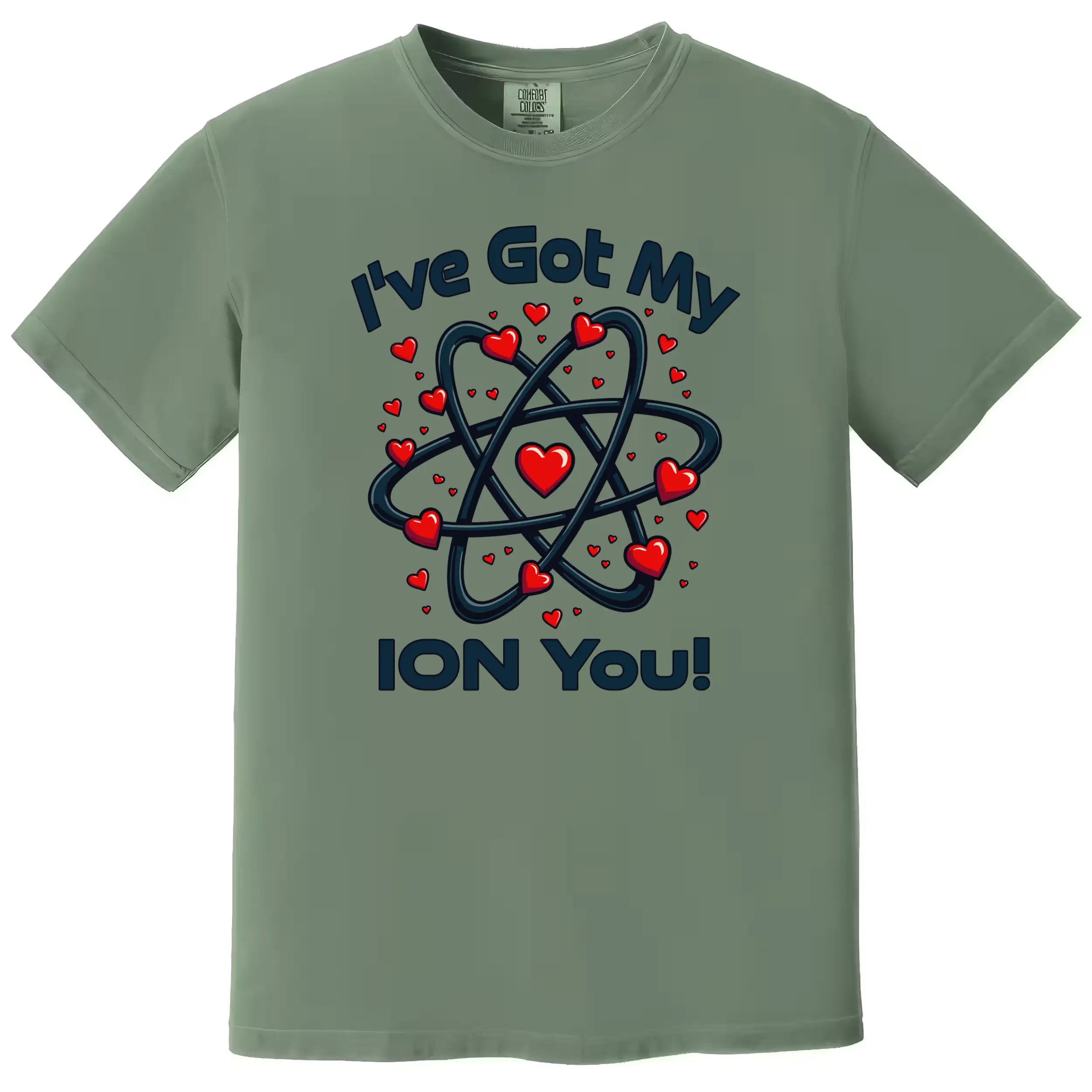 Green science pun Valentine shirt flat lay showing atom design and “I’ve Got My Ion You” lettering for nerdy couples.