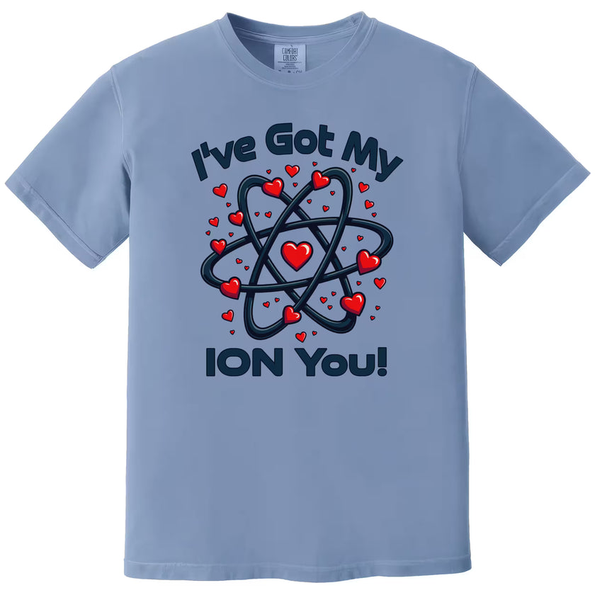Blue “I’ve Got My Ion You” chemistry Valentine shirt flat lay with playful science graphic and heart design.