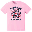 Pink Valentine’s Day chemistry tee laid flat, featuring a fun “I’ve Got My Ion You” design with heart accents.