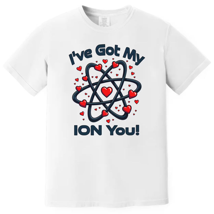 White nerdy Valentine t-shirt featuring “I’ve Got My Ion You” text and chemistry atom graphic, styled flat on white backdrop.