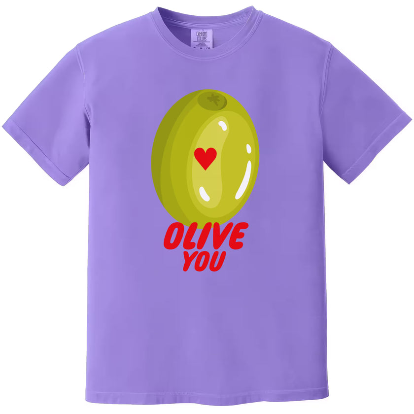 Olive You pun t-shirt flat lay in purple, playful Valentine’s Day tee with heart and olive design