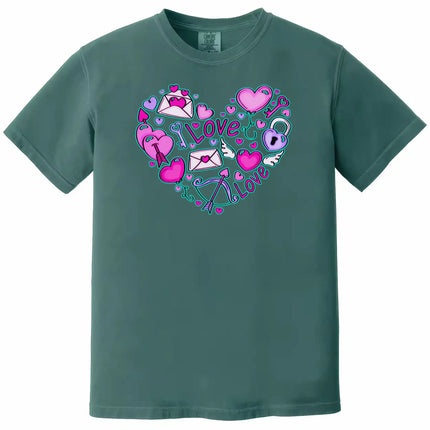 Teal shirt flat lay on white background showing whimsical Valentine’s heart doodles, letters, and balloons.