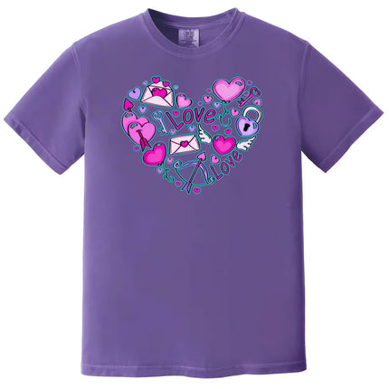 Purple shirt flat lay on white background featuring intricate Valentine’s Love Doodle heart full of love-themed graphics.