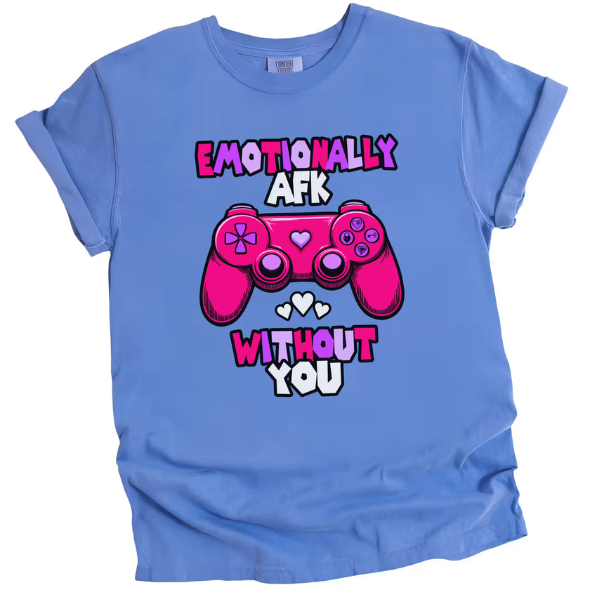 Blue “Emotionally AFK” gamer shirt with playful heart and game controller graphics, laid flat on white background.