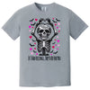 Gray shirt flat lay with spooky Valentine skeleton pun tee, heart hands gesture, and moody gothic design.
