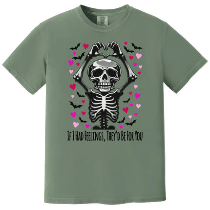 Green shirt flat lay displaying skeleton heart hands, pink and red hearts, and “If I Had Feelings” pun text.