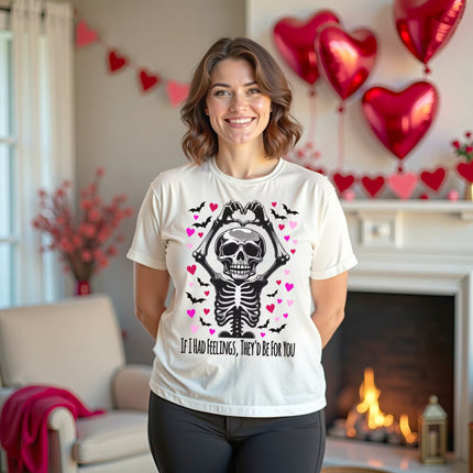 Female model wearing white skeleton heart hands Gothic Valentine tee in a living room decorated for Valentine’s Day.
