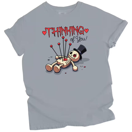 Thinking of You graphic tee with voodoo doll design, gray shirt flat lay, edgy romantic aesthetic, Valentine’s Day t-shirt gift