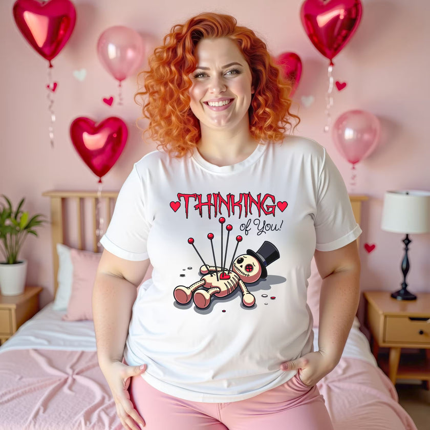 Thinking of You Valentine’s t-shirt worn by woman in heart-decorated bedroom, romantic cozy aesthetic, women’s graphic tee for Valentine’s Day