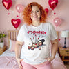 Thinking of You Valentine’s t-shirt worn by woman in heart-decorated bedroom, romantic cozy aesthetic, women’s graphic tee for Valentine’s Day