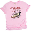 Thinking of You Valentine’s t-shirt with voodoo doll art, pink shirt flat lay, cute dark humor aesthetic, love themed graphic tee
