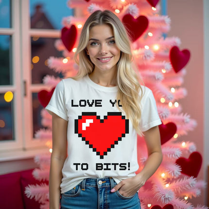 Female model wearing white Love You to Bits t-shirt with pixelated red heart, standing in living room at night for Valentine’s style