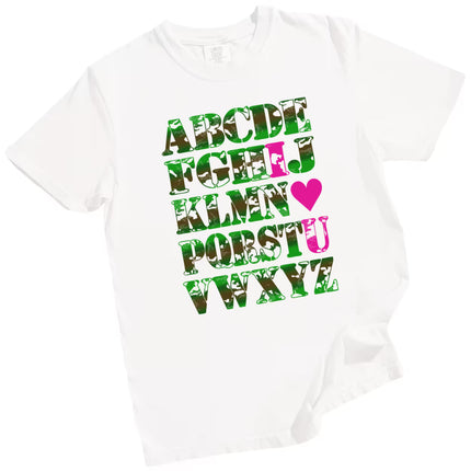 White “I ♥ U” Valentine’s tee flat lay, camo alphabet letters, romantic pun