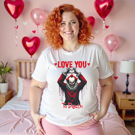 Female model wearing white “Love You to Death” horror clown Valentine shirt in bedroom with dark romantic vibe