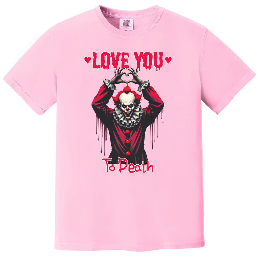 Pink “Love You to Death” gothic Valentine shirt with creepy clown heart hands design on white background