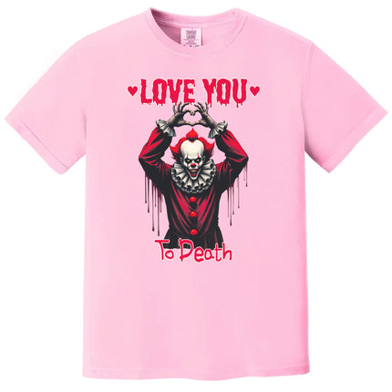 Pink “Love You to Death” gothic Valentine shirt with creepy clown heart hands design on white background