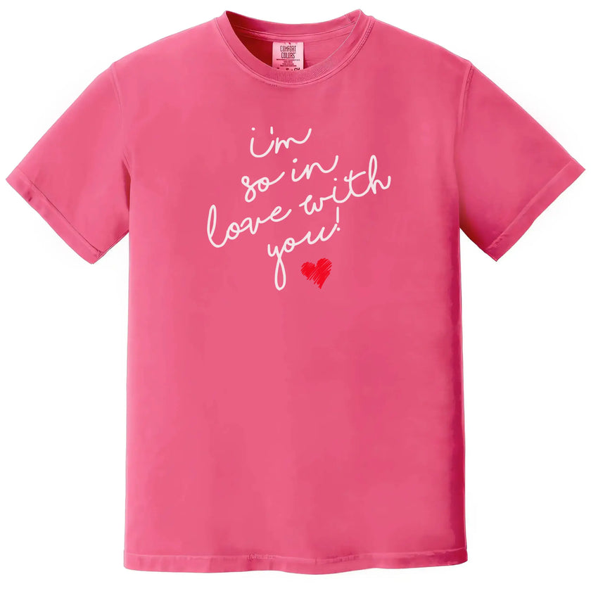 Pink “I’m So In Love With You” t-shirt with white script lettering and red heart, sweet Valentine’s Day outfit with romantic vibe