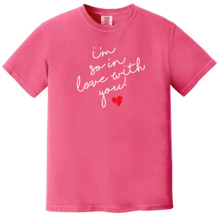 Pink “I’m So In Love With You” t-shirt with white script lettering and red heart, sweet Valentine’s Day outfit with romantic vibe