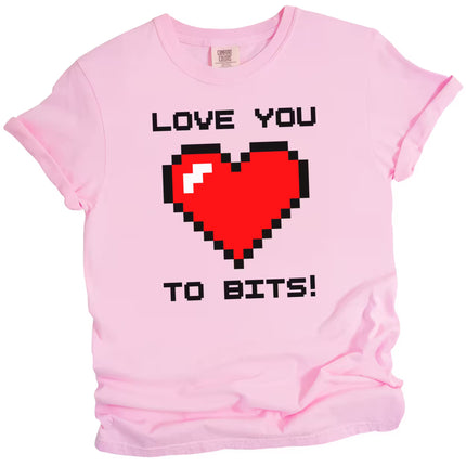 Pink Love You to Bits t-shirt with pixel heart illustration, playful gamer vibe, flat lay on white background