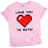 Pink Love You to Bits t-shirt with pixel heart illustration, playful gamer vibe, flat lay on white background
