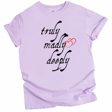Light purple Truly Madly Deeply t-shirt flat lay featuring bold lettering and red heart design, perfect for Valentine’s or gift giving.