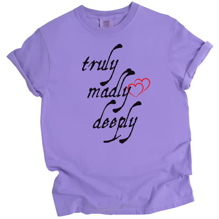 Purple Truly Madly Deeply t-shirt flat lay with bold vertical lettering and heart detail, fun love-themed women’s tee.
