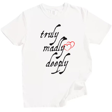 White Truly Madly Deeply t-shirt flat lay showing bold black lettering and red heart, romantic graphic tee for gifting.