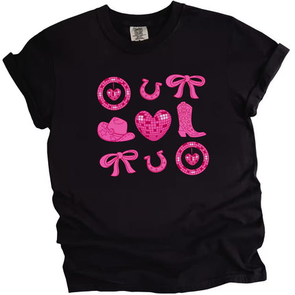 Black cowgirl coquette Valentine’s tee with hearts, boots, bows, and pink accents flat on white.
