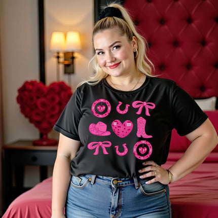 Female model wearing black cowgirl coquette Valentine’s tee standing in a fancy hotel room decorated for Valentine’s Day.