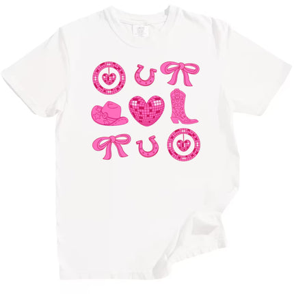White cowgirl coquette Valentine’s shirt featuring hearts, boots, and horseshoes, flat lay on white background