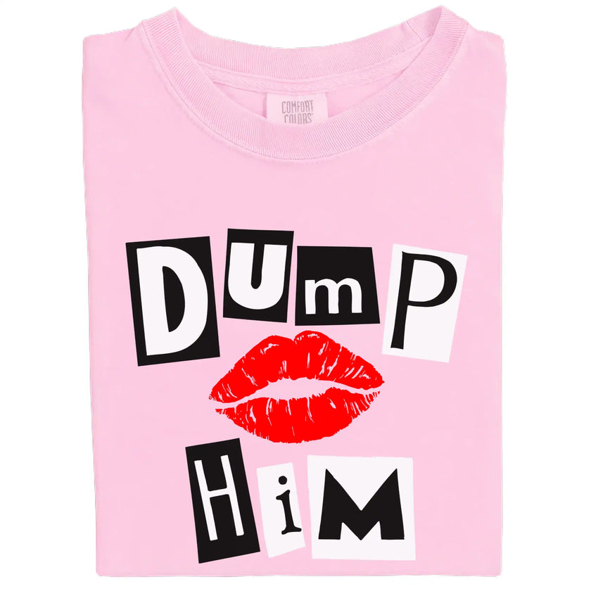 Folded light pink “Dump Him” Valentine’s tee with bold magazine-style letters and red lips on white background.