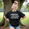 Female model wearing black “Well-Behaved Women Seldom Make History” t-shirt, casual setting showing confident and empowering feminist energy