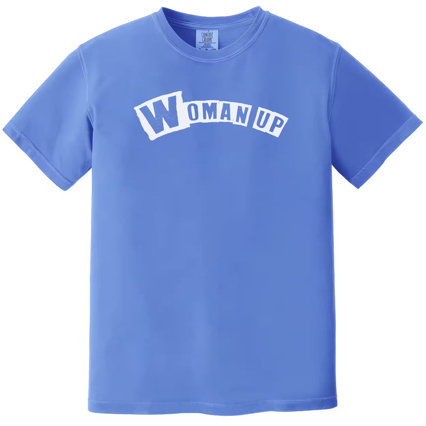 Blue “Woman Up” t-shirt flat lay featuring positive empowering text for confident women