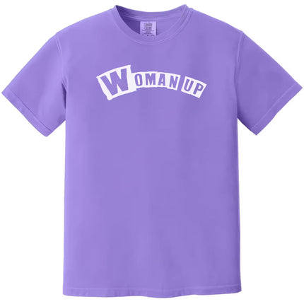 Purple “Woman Up” t-shirt flat lay showcasing empowering feminist statement with bold lettering for women