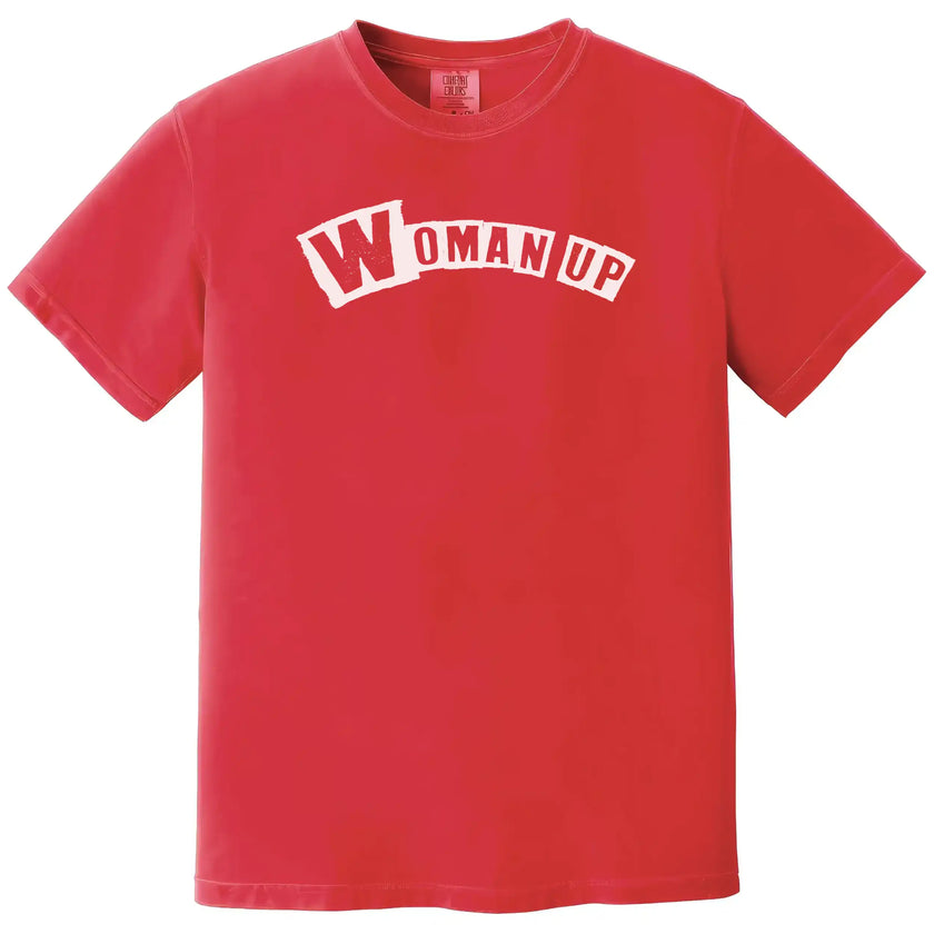 Red “Woman Up” t-shirt flat lay featuring bold lettering and empowering feminist message for women in everyday wear
